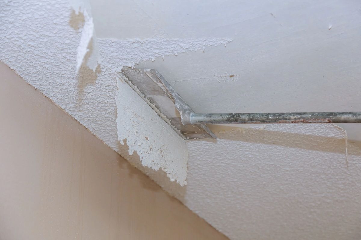 Removing popcorn ceilings to attract buyers and enhance property value